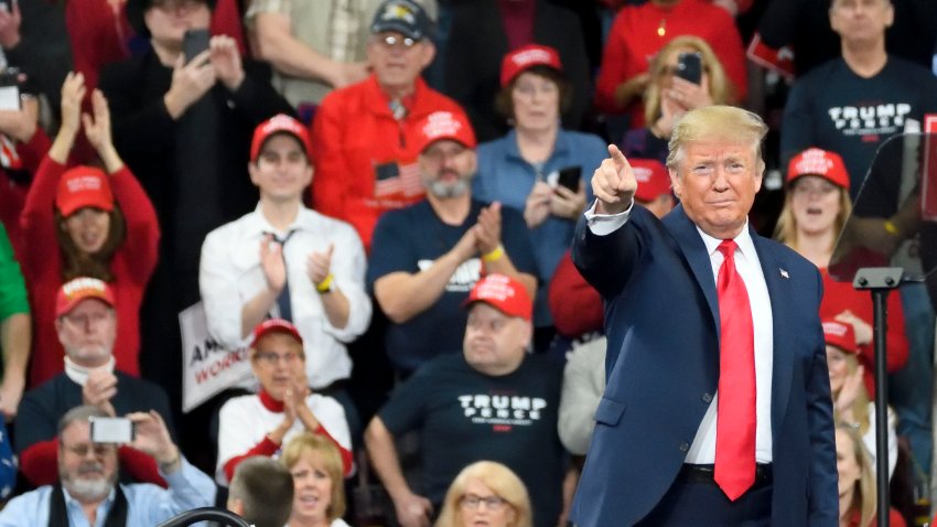 In this Dec. 10, 2019, file photo, U.S. President Donald Trump greets supporters as he steps on the stage for a campaign rally with Vice President Mike Pence at the Giant Center in Hershey, PA.