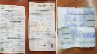 Foto de dos certificados de nacimiento y una carta con informacion de contacto.