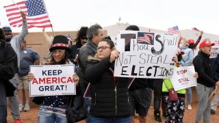Supporters of President Donald Trump protest outside the Clark County Election Department