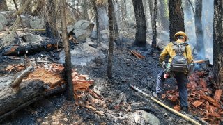 A firefighter works at the scene of a wildfire near Lake Tahoe.