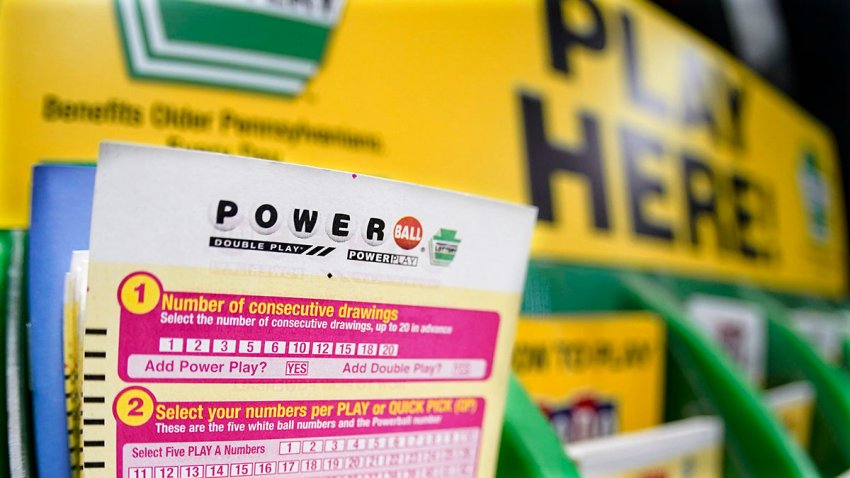 A rack with cards bettors can use to choose their Powerball numbers at a market in Prospect, Pa., Oct. 28, 2022.