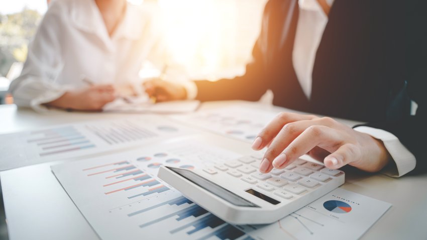 The financiers are calculating personal taxes for their customers.