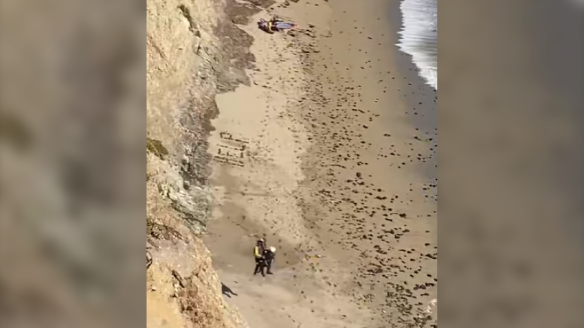 A stranded kite surfer is hoisted to safety in Santa Cruz County.