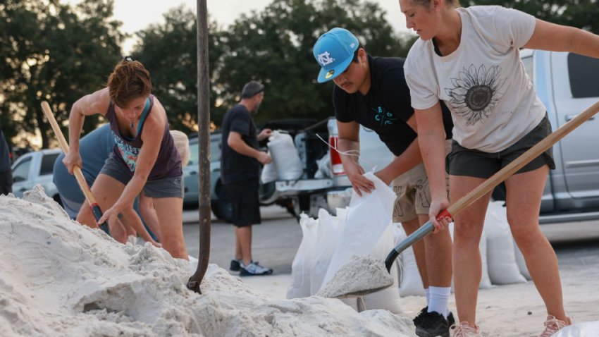 PINELLAS PARK, FLORIDA – SEPTEMBER 25: Residents fill sandbags at Helen Howarth Park ahead of the possible arrival of Hurricane Helene on September 25, 2024 in Pinellas Park, Florida. Currently, Tropical Storm Helene is forecast to become a major hurricane, bringing the potential for deadly storm surges, flooding rain, and destructive hurricane-force winds along parts of the Florida West Coast. Helene is expected to make landfall in Florida on Thursday. (Photo by Joe Raedle/Getty Images)