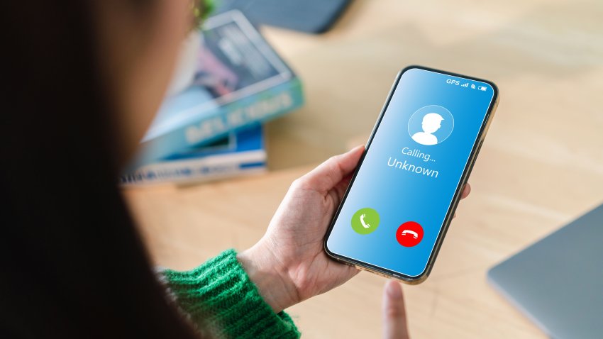 Human use smartphone with incoming call from unknown number, spam, prank caller, hoax person, fake identity, scammer, scam with mobile phone, hacker, call center, crime, call, fraud or phishing