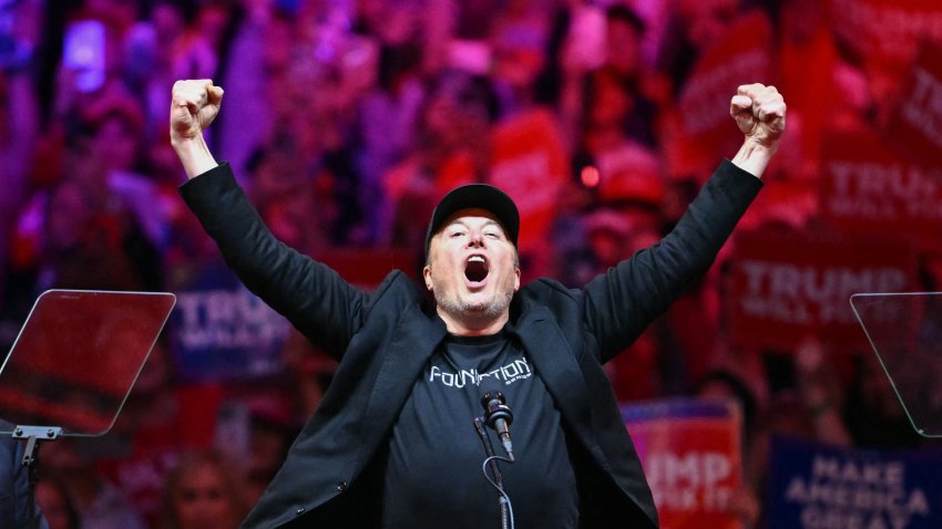 TOPSHOT – Tesla and SpaceX CEO Elon Musk gestures as he steps on stage during a rally for former US President and Republican presidential candidate Donald Trump at Madison Square Garden in New York, October 27, 2024. (Photo by ANGELA WEISS / AFP) (Photo by ANGELA WEISS/AFP via Getty Images)