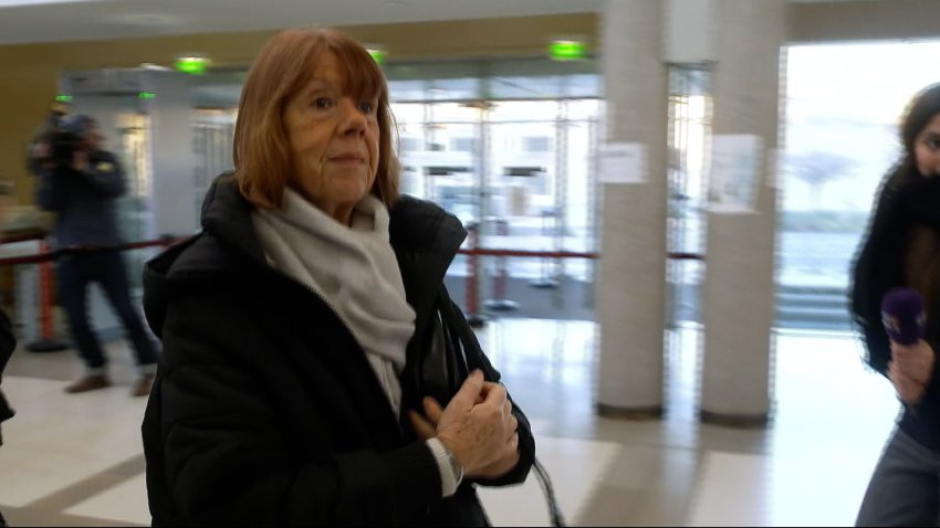 Gisèle Pelicot walks into a court room