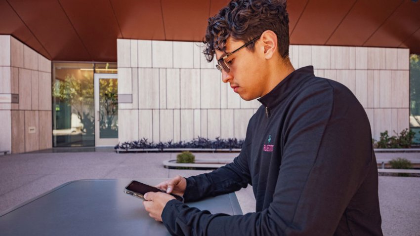 Angel Palazuelos, 22, who graduated with a degree in biomedical engineering at Arizona State University, looks at election results on his phone in Phoenix, in Arizona, on November 6, 2024. Angel Palazuelos hasn’t slept much since he heard Donald Trump was returning to the White House: at 22, this young undocumented immigrant from Phoenix, Arizona, is haunted by the new president’s promises of mass deportations. (Photo by Olivier Touron / AFP) (Photo by OLIVIER TOURON/AFP via Getty Images)