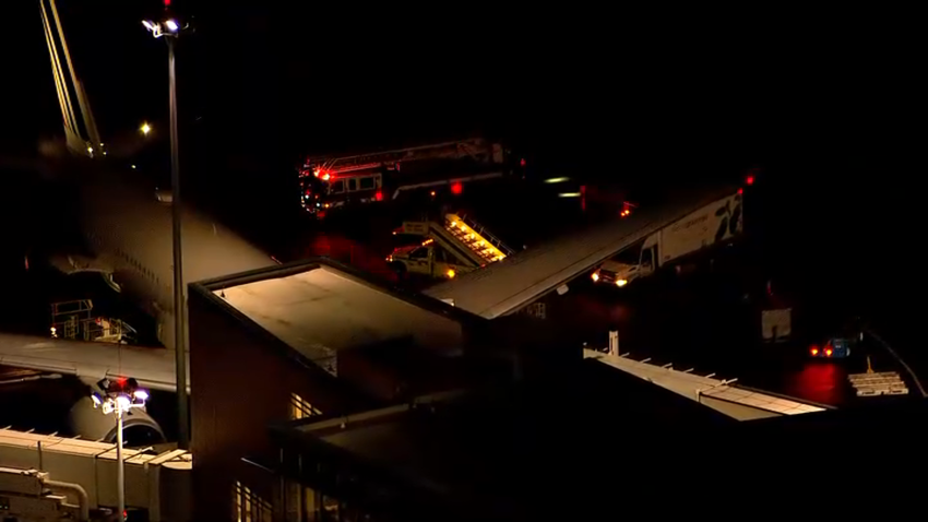 A fire truck was seen by an Air France plane at Boston's Logan International Airport on Tuesday, Jan. 14, 2025.