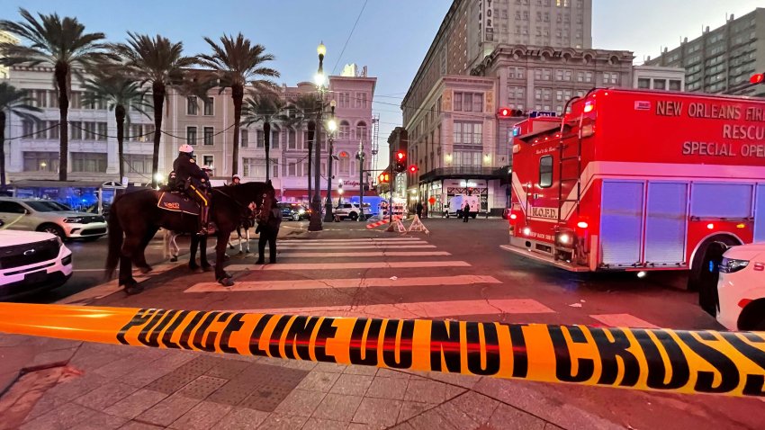 Police cordon off the intersection of Canal Street and Bourbon Street in the French Quarter of New Orleans, Louisiana, on January 1, 2025. At least 15 people were killed and 30 injured Wednesday when a vehicle plowed overnight into a New year’s crowd in the heart of the thriving New Orleans tourist district, authorities in the southern US city said. (Photo by Matthew HINTON / AFP) (Photo by MATTHEW HINTON/AFP via Getty Images)