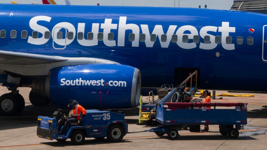 Baggage handlers load luggage onto a Southwest Airlines Boeing 737 at Austin-Bergstrom International Airport on August 24, 2024 in Austin, Texas. 