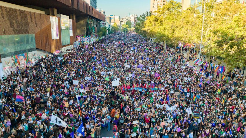 TOPSHOT – Women take part in a demonstration to mark the International Women’s Day in Santiago, on March 8, 2022. (Photo by JAVIER TORRES / AFP) (Photo by JAVIER TORRES/AFP via Getty Images)