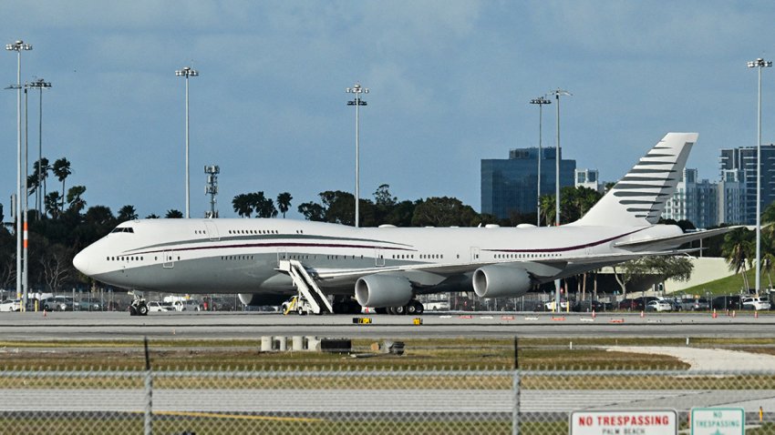 In this February 15, 2025 a Qatari Boeing 747 sits on the tarmac of Palm Beach International airport after US President Donald Trump toured the aircraft on February 15, 2025. Donald Trump plans to accept a luxury Boeing jet from the Qatari royal family for use as Air Force One and then continue flying in it after his tenure, despite strict rules on US presidential gifts, media reported May 11, 2025. Calling the plane a “flying palace,” ABC News, which first reported the story, said the Boeing 747-8 jumbo jet would possibly be the most expensive gift ever received by the American government. (Photo by ROBERTO SCHMIDT / AFP) (Photo by ROBERTO SCHMIDT/AFP via Getty Images)