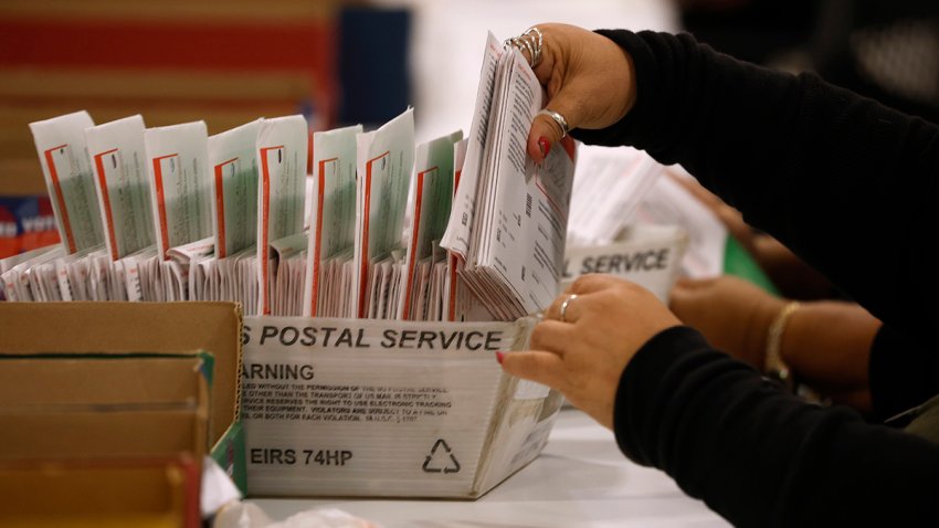 File - An election worker processes mail-in ballots at the Los Angeles County Ballot Processing Center on June 5, 2026, in City of Industry, California.